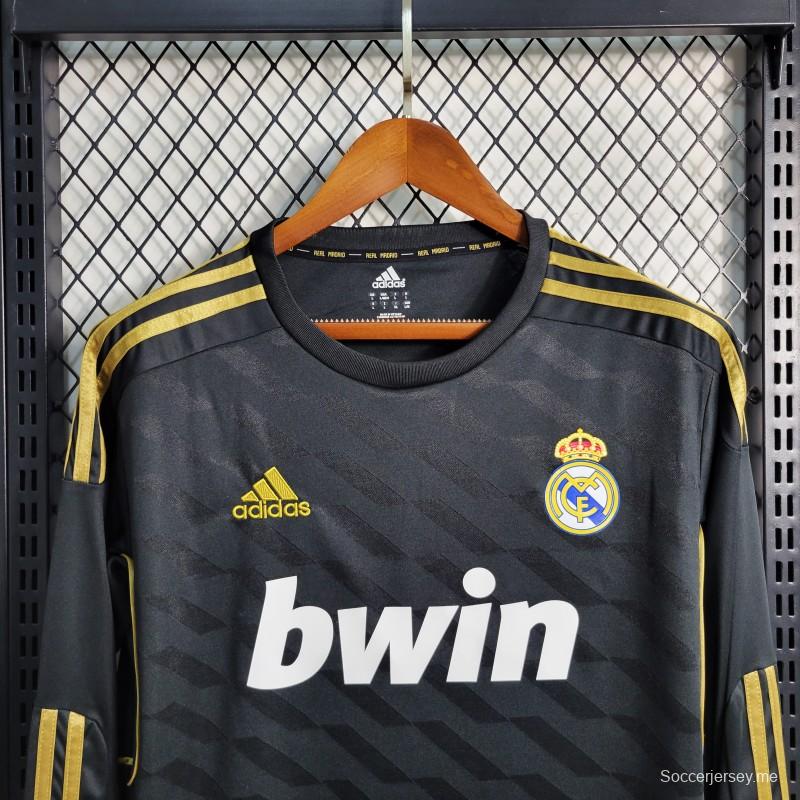 قميص بأكمام طويلة ريترو 2011/12 ريال مدريد ذهاباً وإياباً أسود اللون
