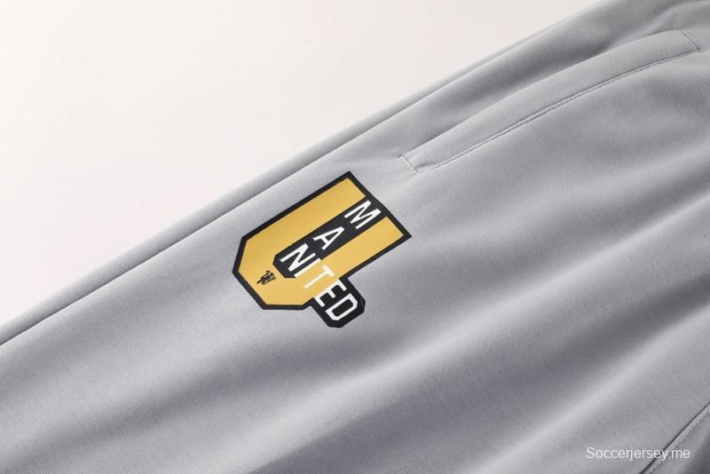 25/26 مانشستر يونايتد هويد جاكيت بسحاب كامل رمادي اللون هويد 25/26 مانشستر يونايتد + بنطلون طويل