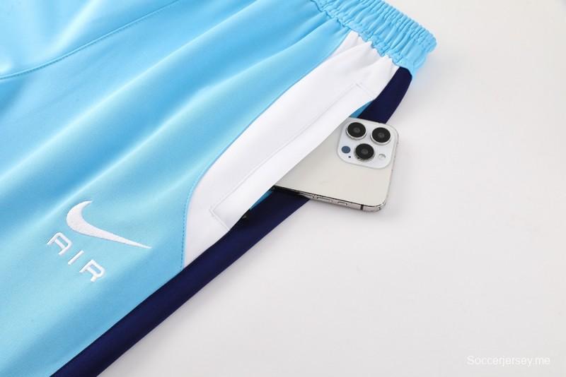 طقم بدلة رياضية نايك إير 2025 - أزرق فاتح مع لمسات كحلية اللون أزرق فاتح مع جاكيت بسحاب كامل + بنطال طويل