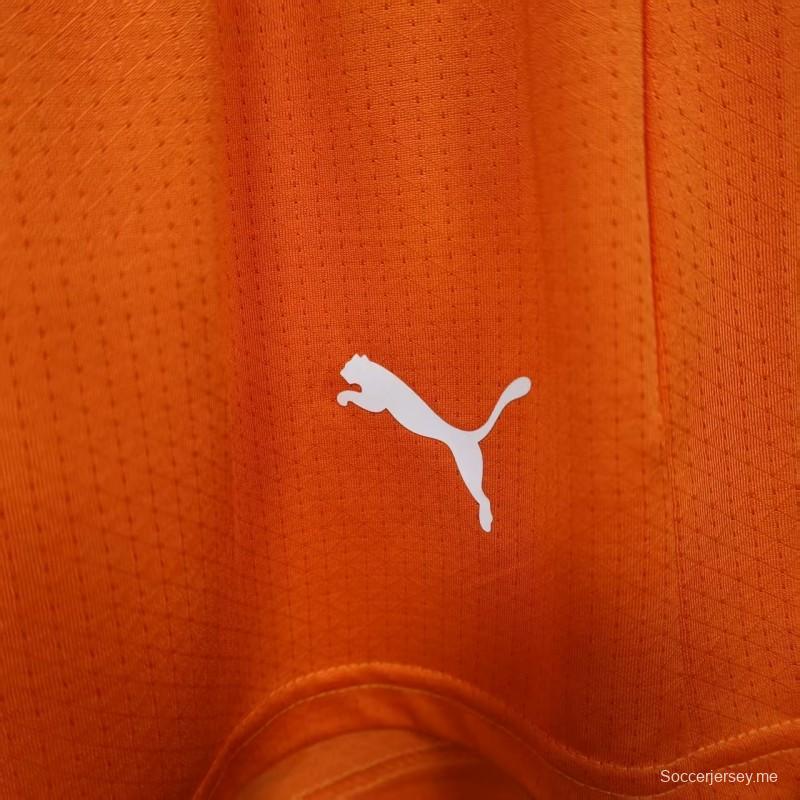 2026 نسخة اللاعب كوت ديفوار برتقالي مع شورت أخضر مع أجزاء جانبية خضراء