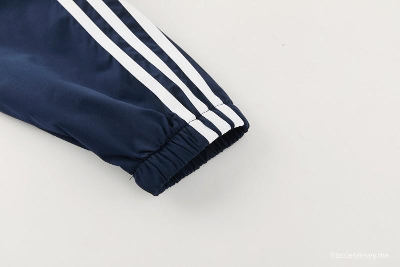 26/27 بدلة رياضية من ريال مدريد باللون الأزرق الداكن مع سترة واقية من الرياح بغطاء للرأس وسحاب كامل + بنطال طويل