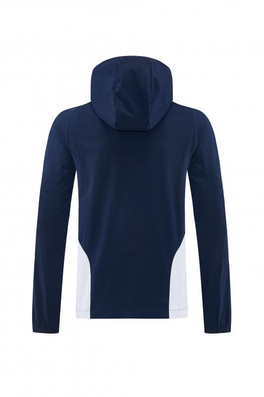 26/27 بدلة رياضية من ريال مدريد باللون الأزرق الداكن مع سترة واقية من الرياح بغطاء للرأس وسحاب كامل + بنطال طويل